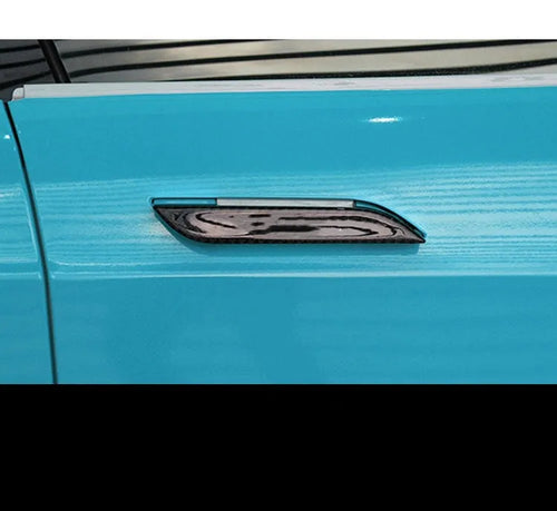 Set of four carbon fibre adhesive protection patches for Tesla Model S door handles.