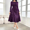 Purple women's dress with long sleeves, ruffle detailing, and mid-waist design