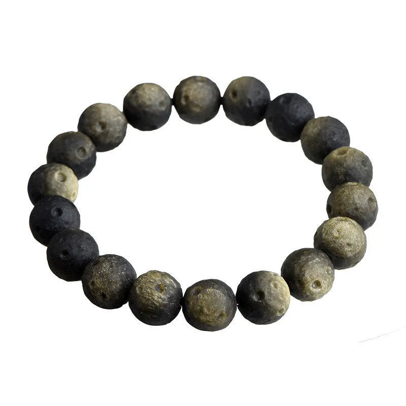 Natural obsidian crater ball bracelet with hand-ground meteorite beads in gold or silver colour options