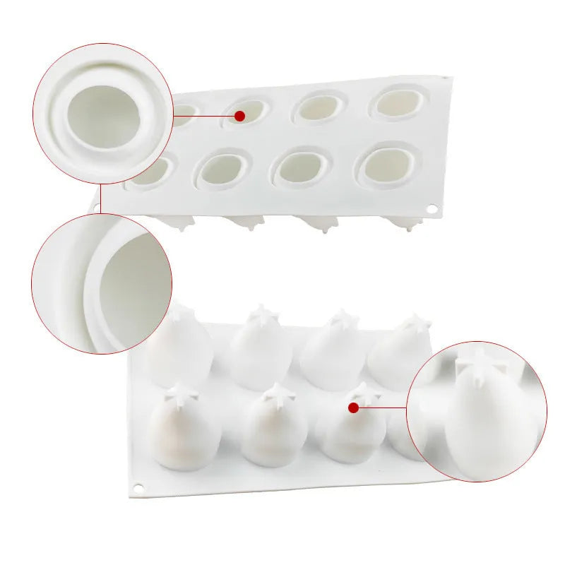 Silicone baking mould with six detailed pineapple and pine cone shaped cavities.