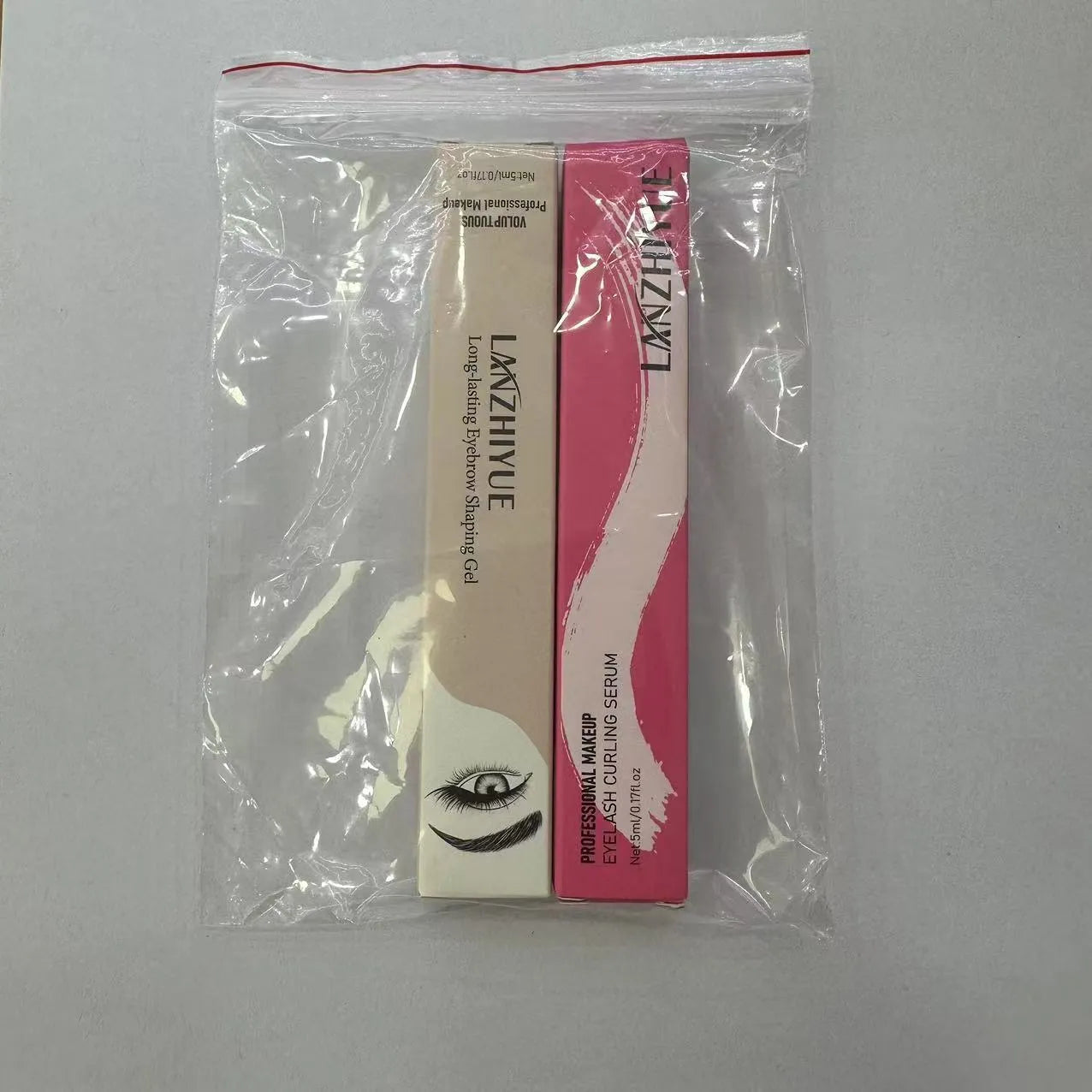 White eyelash growth liquid serum in standard packaging for lash repair and thickening