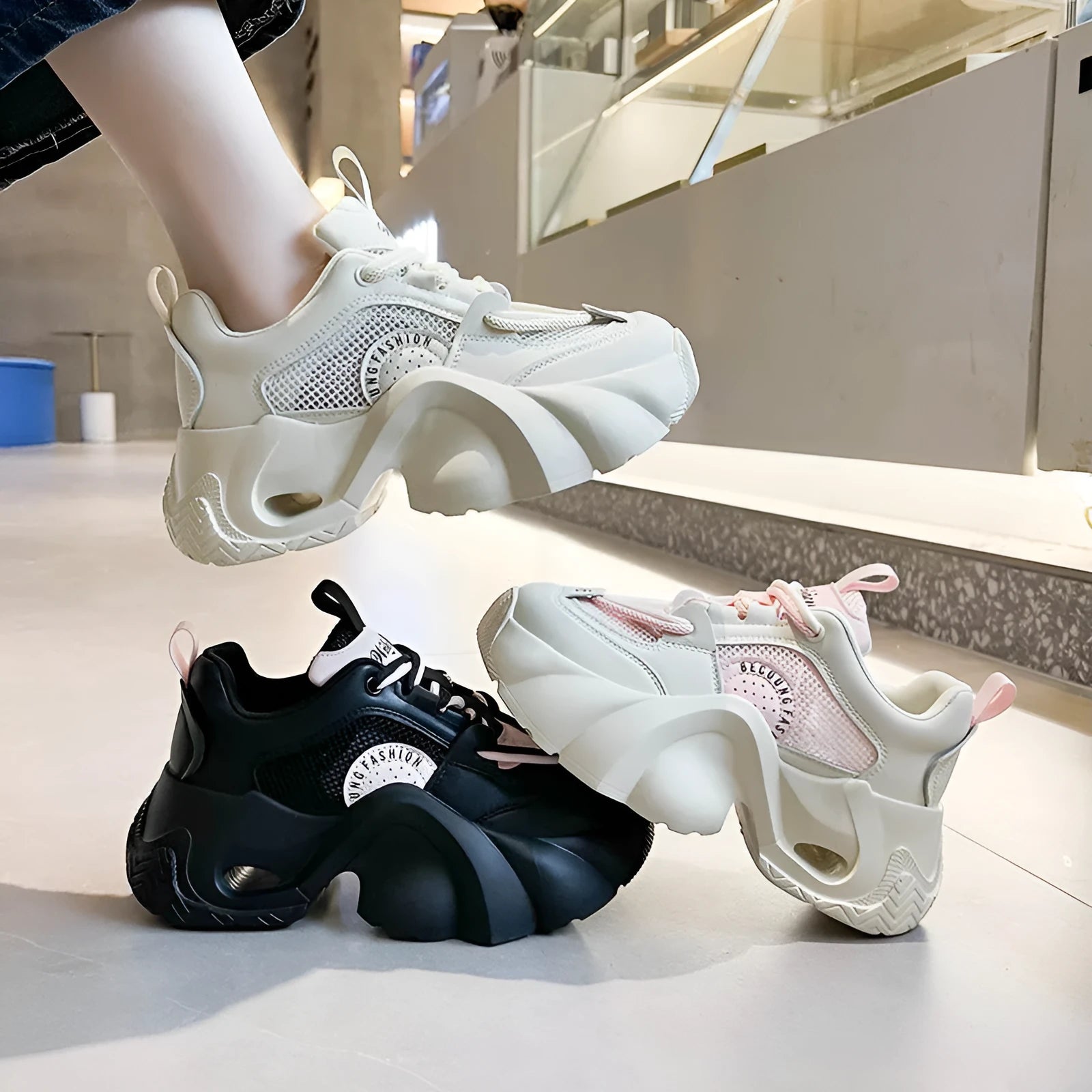 Women's beige platform sneakers with crossover ankle straps and a thick rubber sole.
