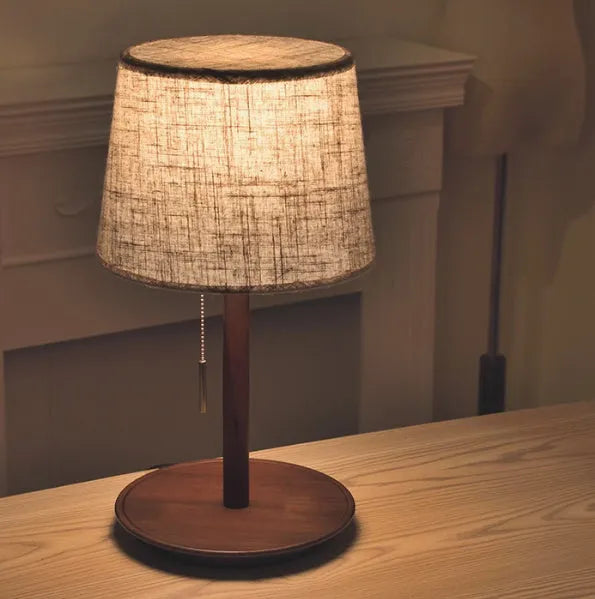 Walnut finish solid wood bedside lamp with fabric shade and cable switch