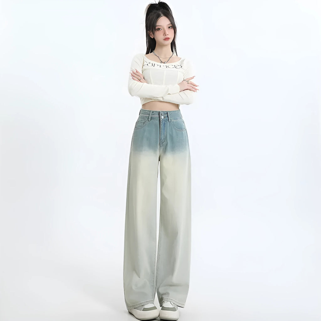 Gradient blue women's denim straight-leg trousers with a wide-leg fit on a hanger