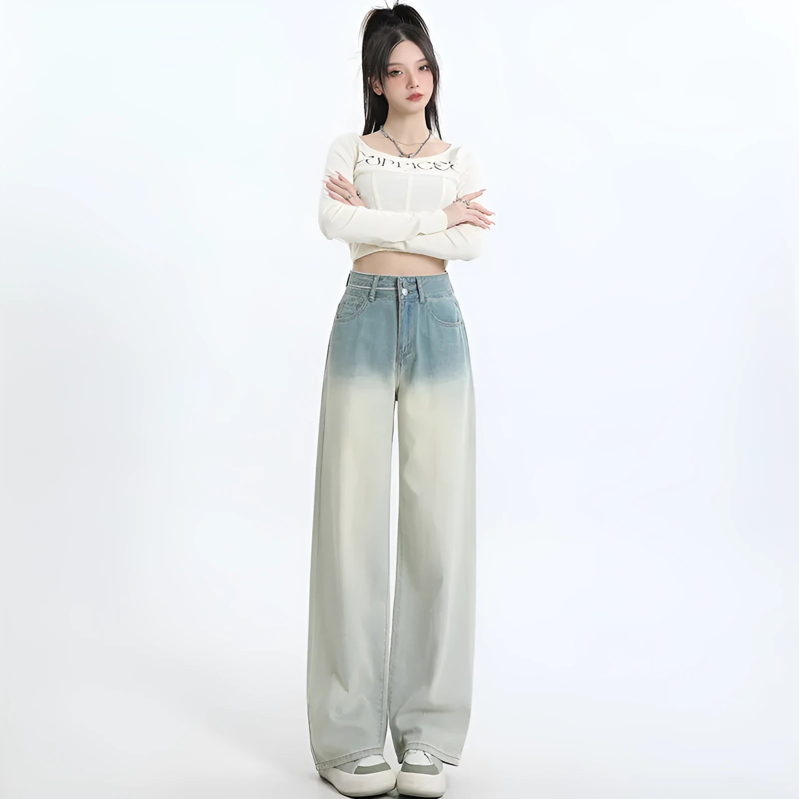 Gradient blue women's denim straight-leg trousers with a wide-leg fit on a hanger