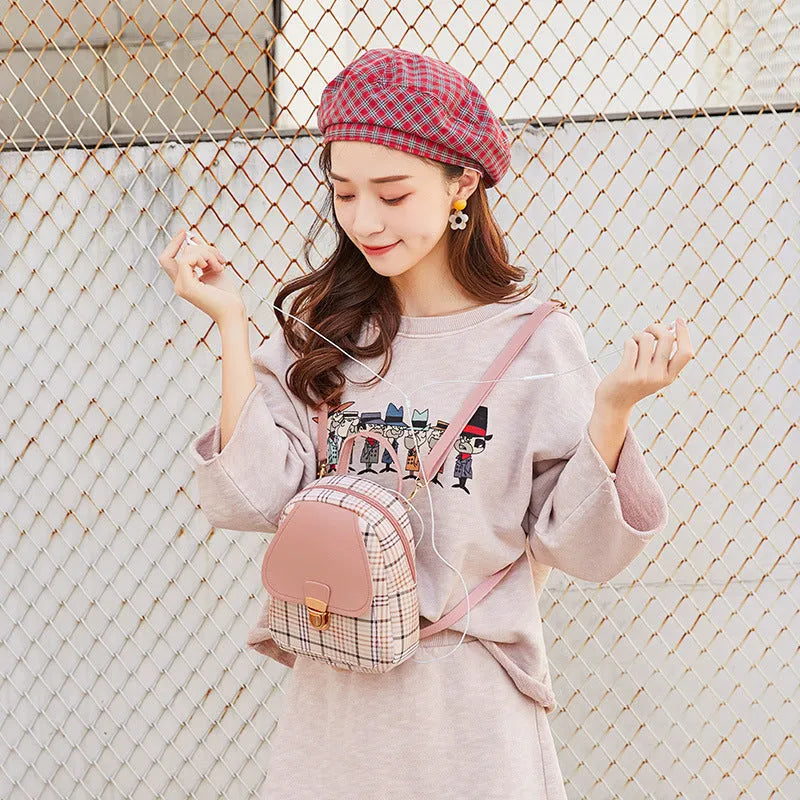 Diagonal cut one shoulder phone bag in PU fabric available in five colours.