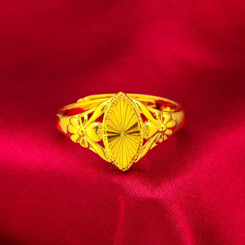 Gold colour brass ring with geometric open diamond flower design and textured details