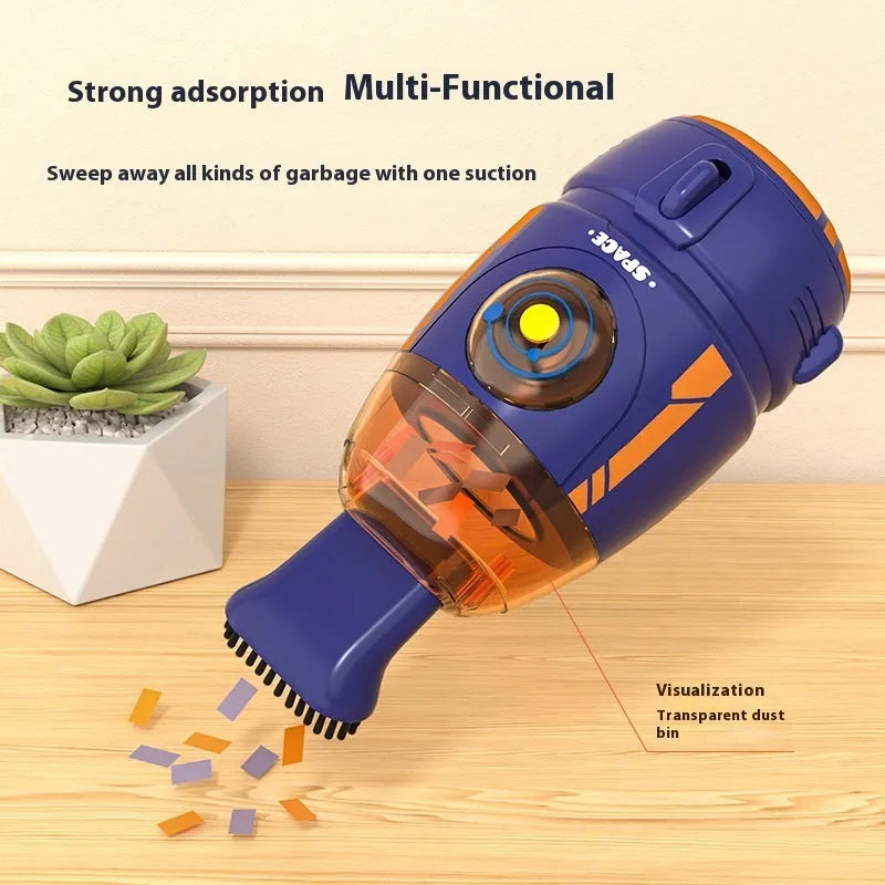 USB-powered handheld desktop vacuum cleaner in blue rocket design on a wooden desk.