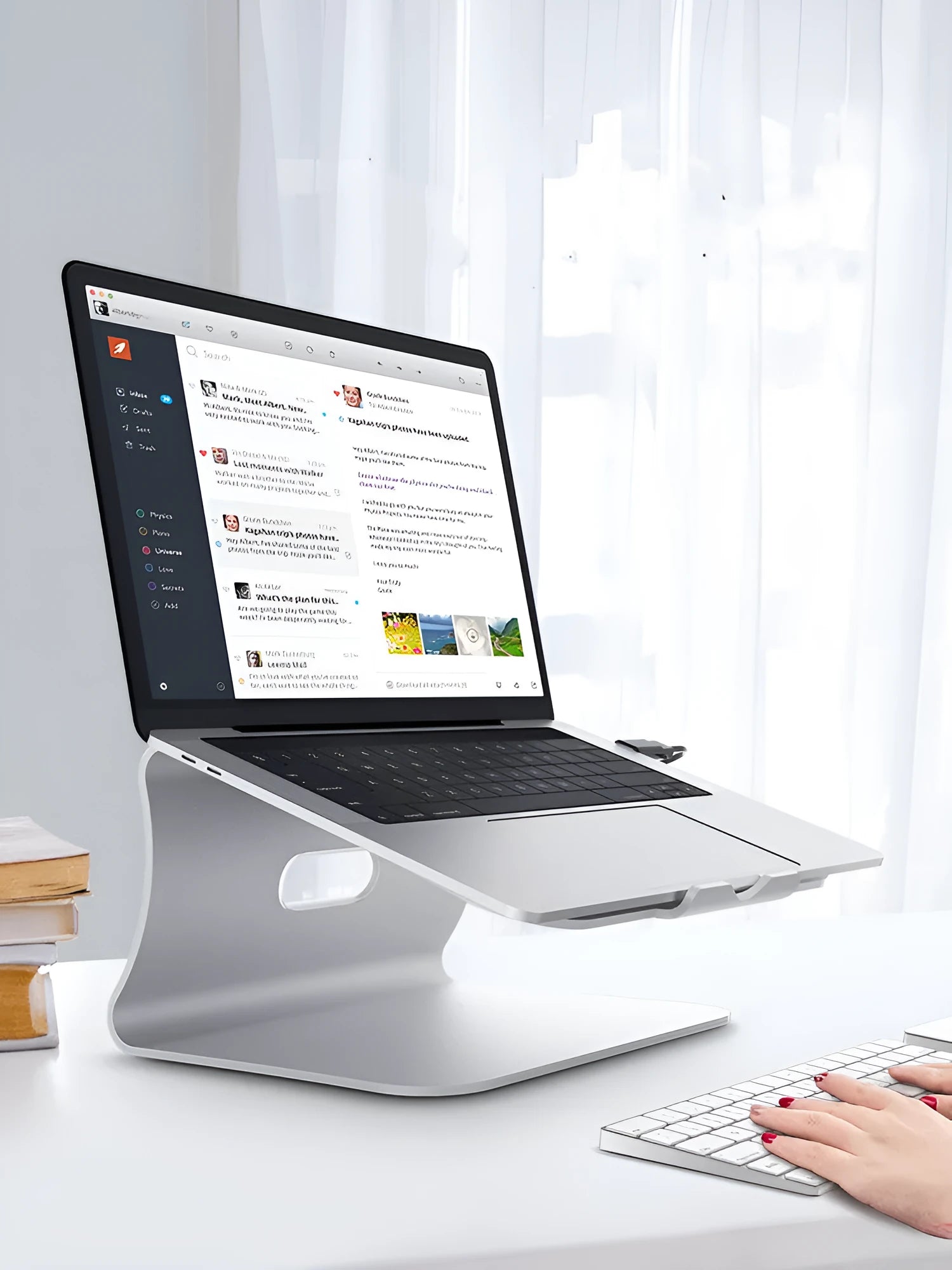 Aluminium alloy rotating cooling bracket for a notebook in grey or silver stripe finish.