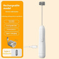 Mini handheld electric milk frother in black, white, and khaki colours with a stainless steel whisk.