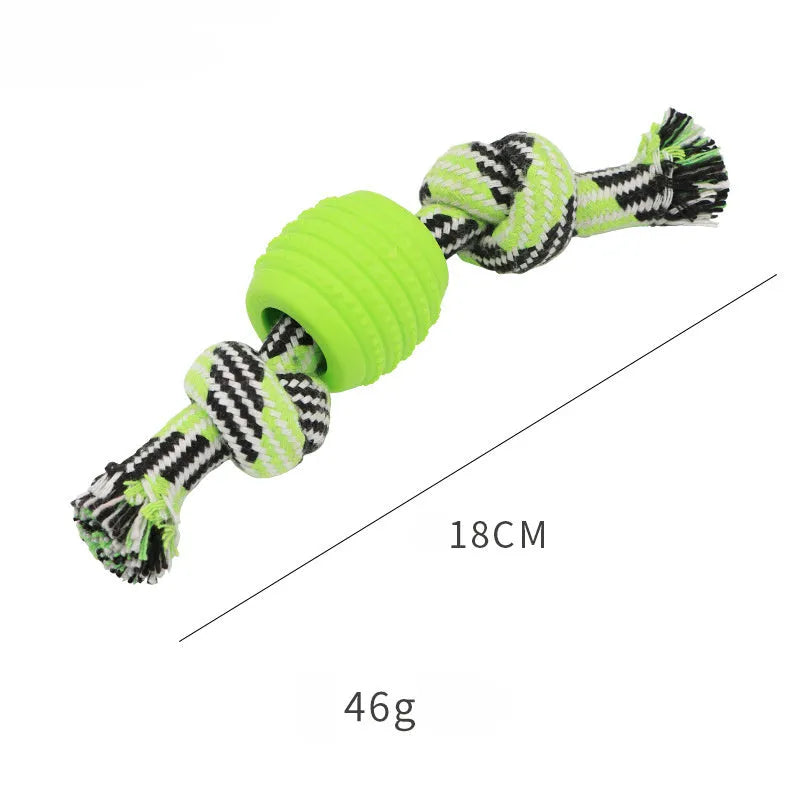 Blue silicone molar-ball dog chew toy with white rope ends on a wooden floor.