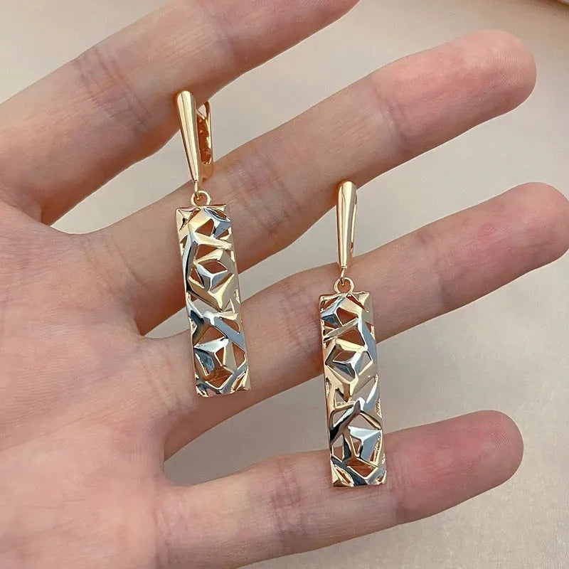 Rectangular two-tone hollow stud earrings for women with a geometric design and picture style finish.