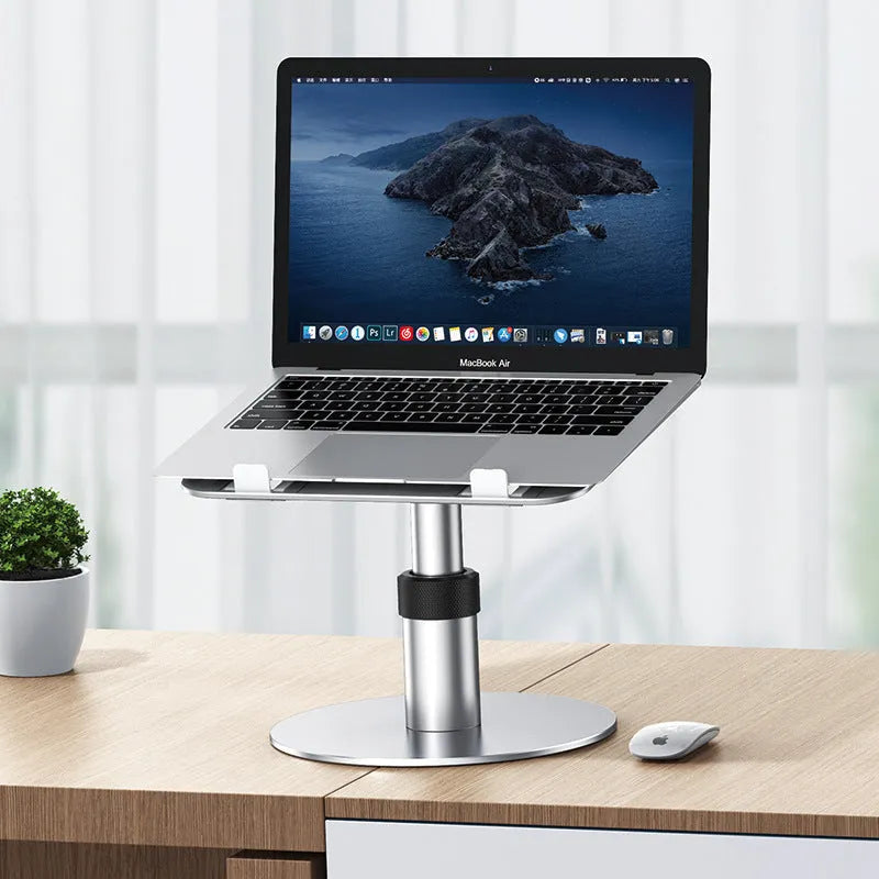 Silver aluminium car laptop stand with adjustable height and rotating base on a car seat.