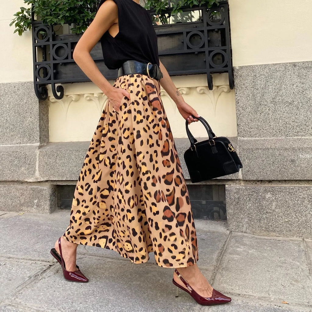 Brown leopard print women's A-line long skirt on hanger showing full length and animal pattern design