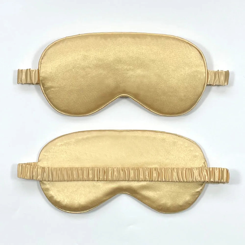 Double-sided silk-like sleep mask in rayon satin, shown in multiple colour options on a white background.