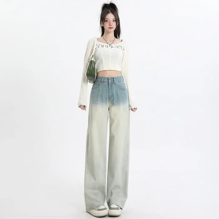 Gradient blue women's denim straight-leg trousers with a wide-leg fit on a hanger