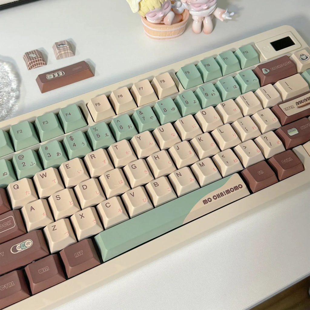 Matcha green themed ergonomic plastic wrist rest for mechanical keyboards with keycap puller.