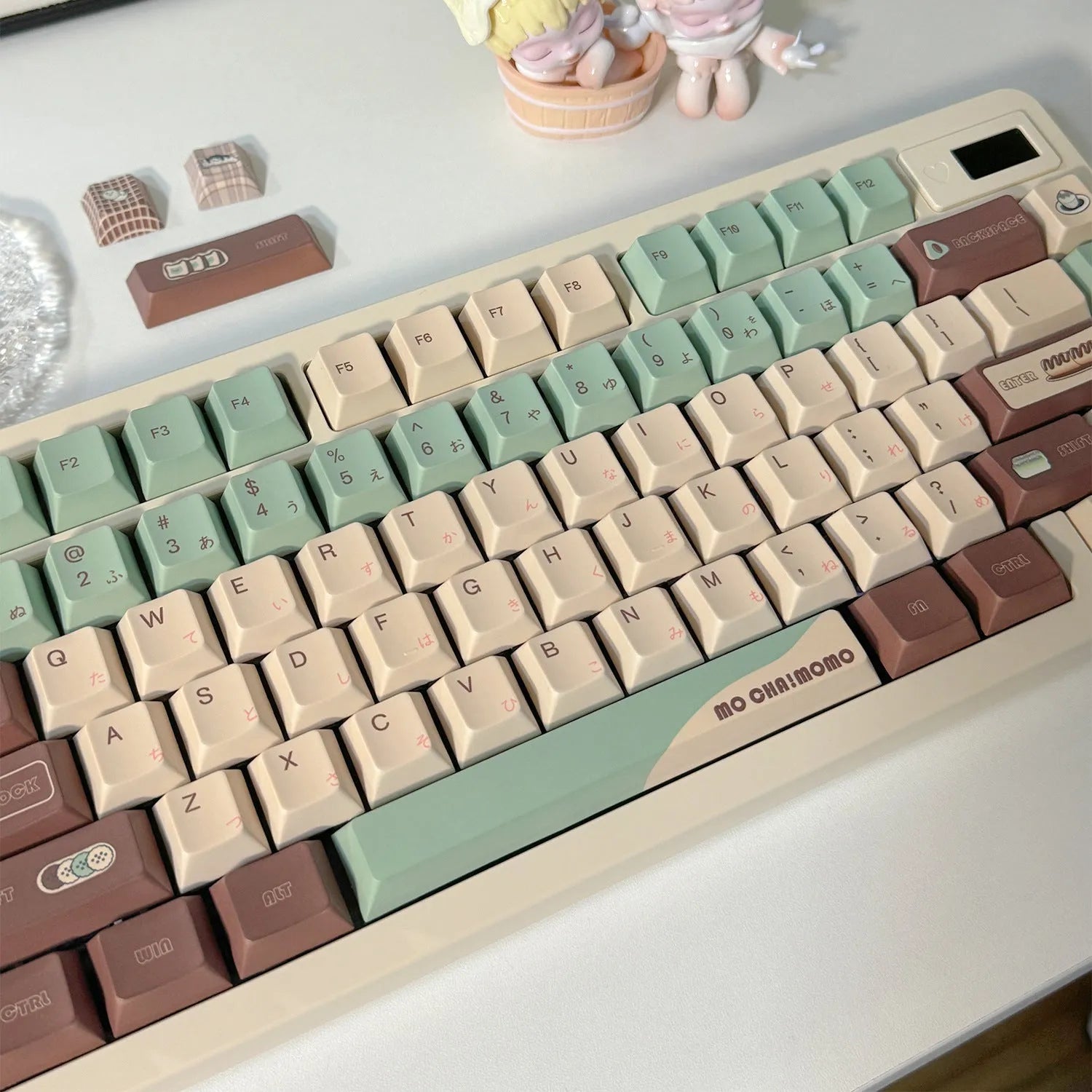 Matcha green themed ergonomic plastic wrist rest for mechanical keyboards with keycap puller.