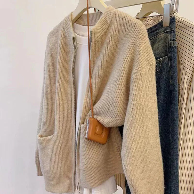 Women's soft sweater coat in temperature-sensitive fabric showing beige colour option with long sleeves and cardigan styling