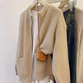 Women's soft sweater coat in temperature-sensitive fabric showing beige colour option with long sleeves and cardigan styling