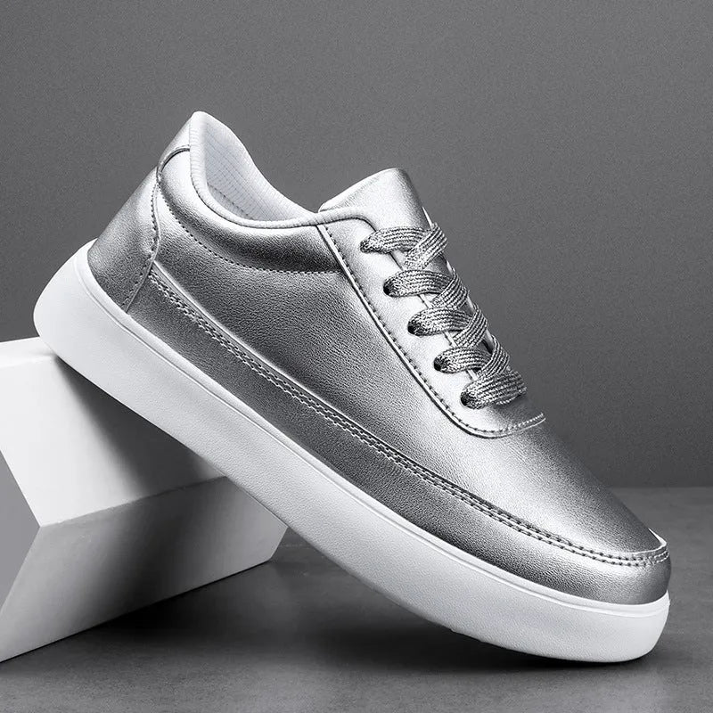 Women's gold leather lace-up flat casual shoes on a white background