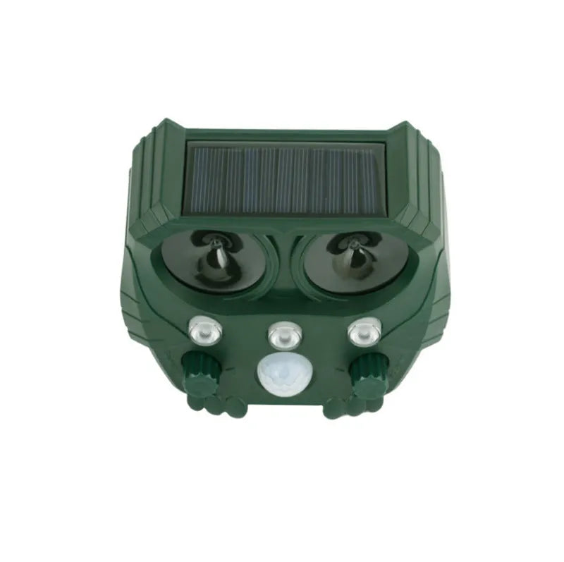 Green solar ultrasonic animal repeller unit with LED strobe lights for outdoor pest control.