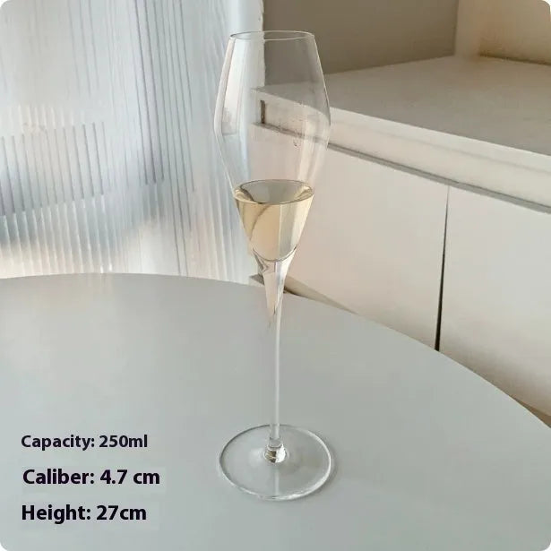 Six French crystal champagne glasses in various designs on dining table