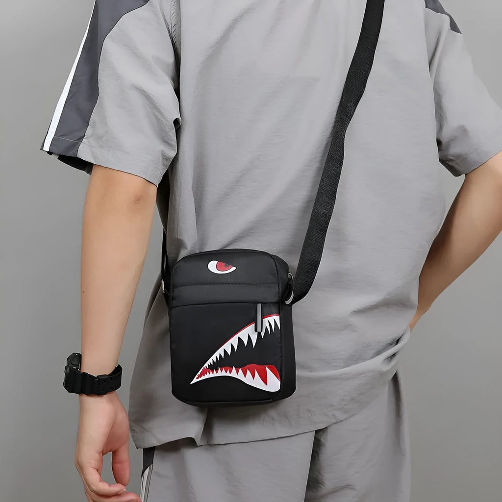 Men's black Oxford cloth crossbody bag with animal print pattern and shoulder strap.