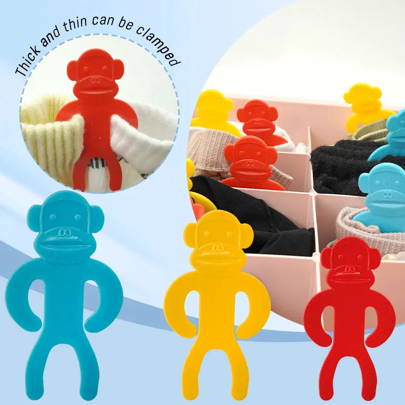 Plastic sock storage clips in blue, yellow, and red colours for organising laundry