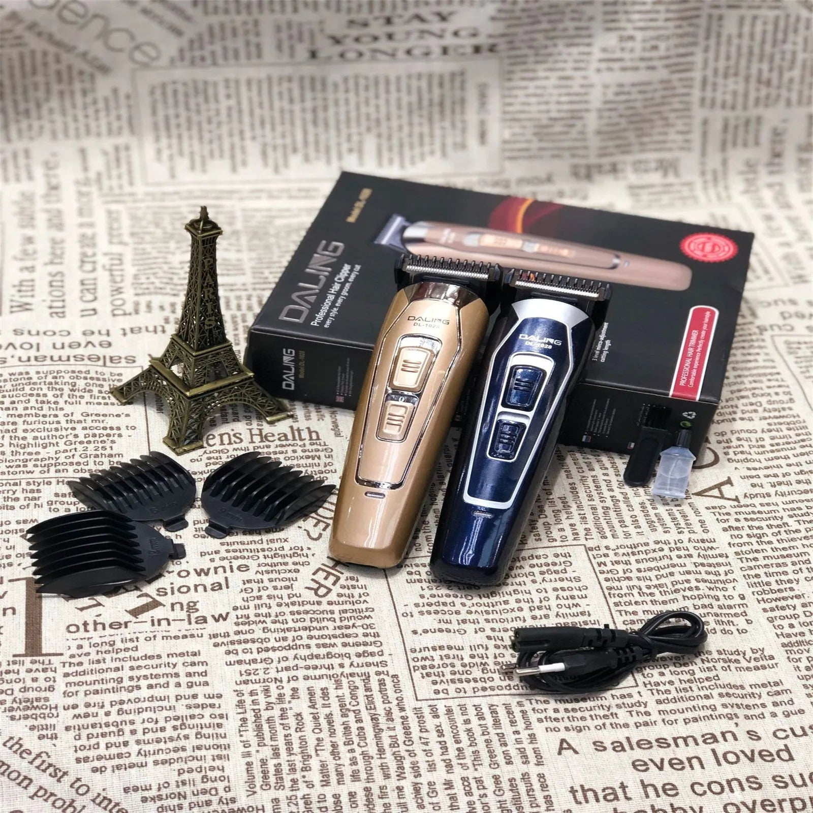 Dark blue cordless electric hair clipper with stainless steel blades on a white background.