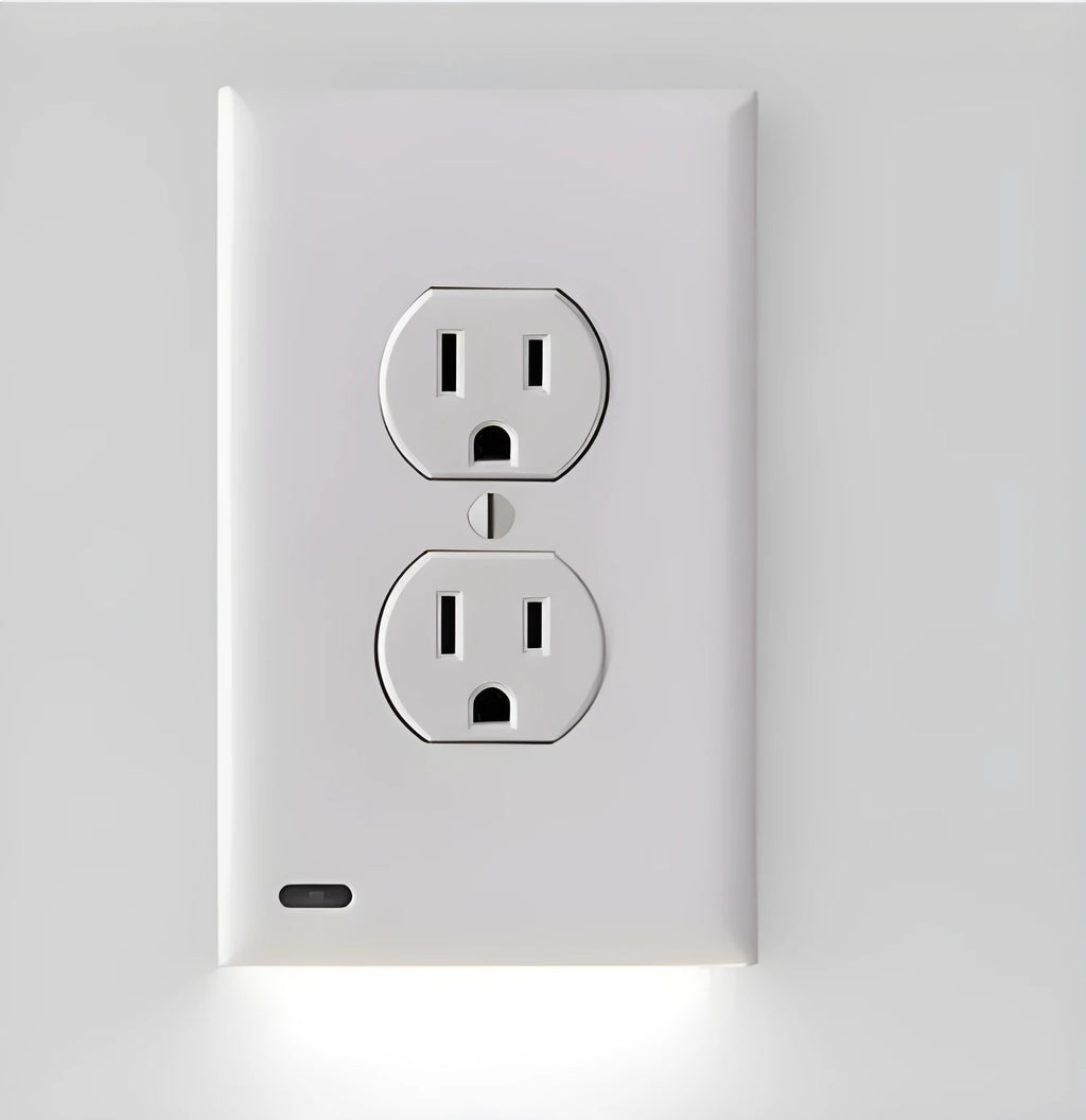White plug-in socket induction LED night light installed in a wall outlet