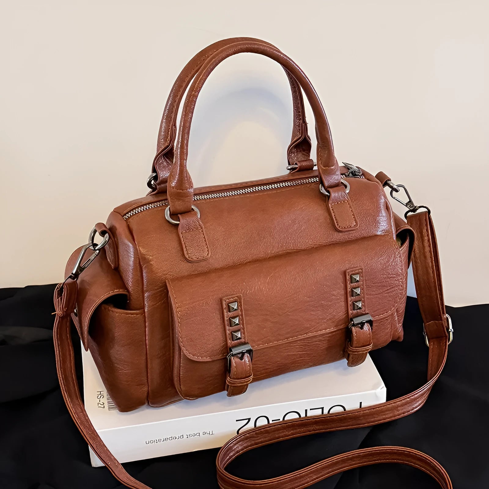 Vintage-style large capacity messenger bag in PU leather, showing contrast stitching and a horizontal square shape.