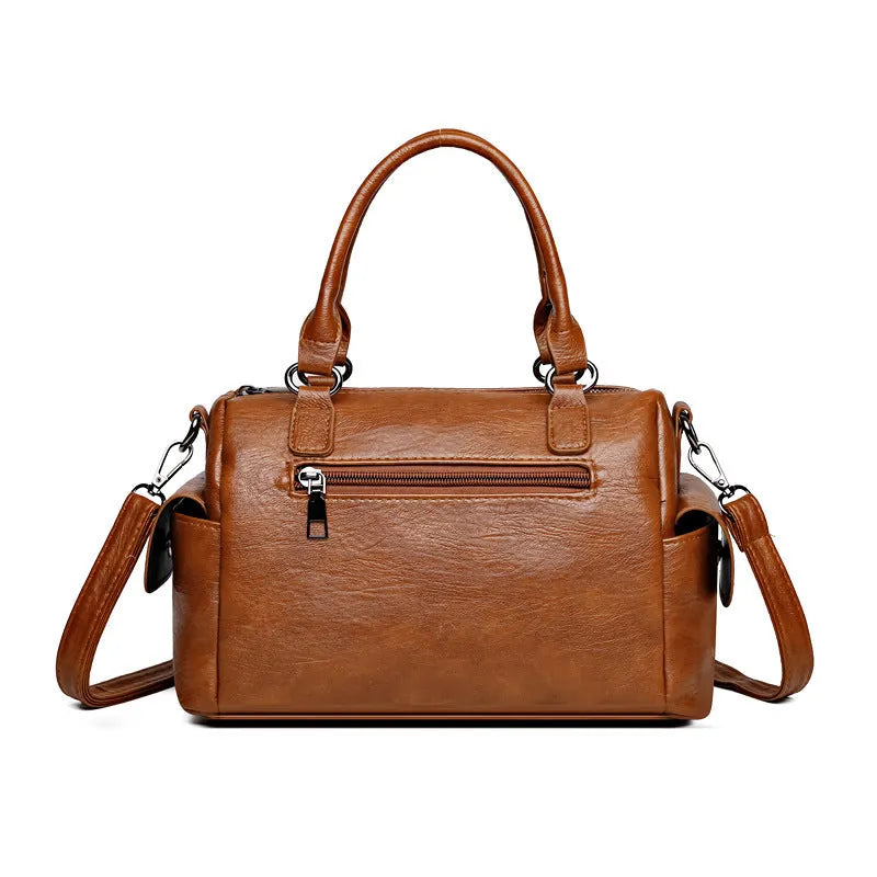 Vintage-style large capacity messenger bag in PU leather, showing contrast stitching and a horizontal square shape.