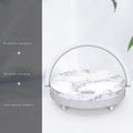 Wireless charging LED night light with Bluetooth speaker and integrated mobile phone holder in marble pattern finish