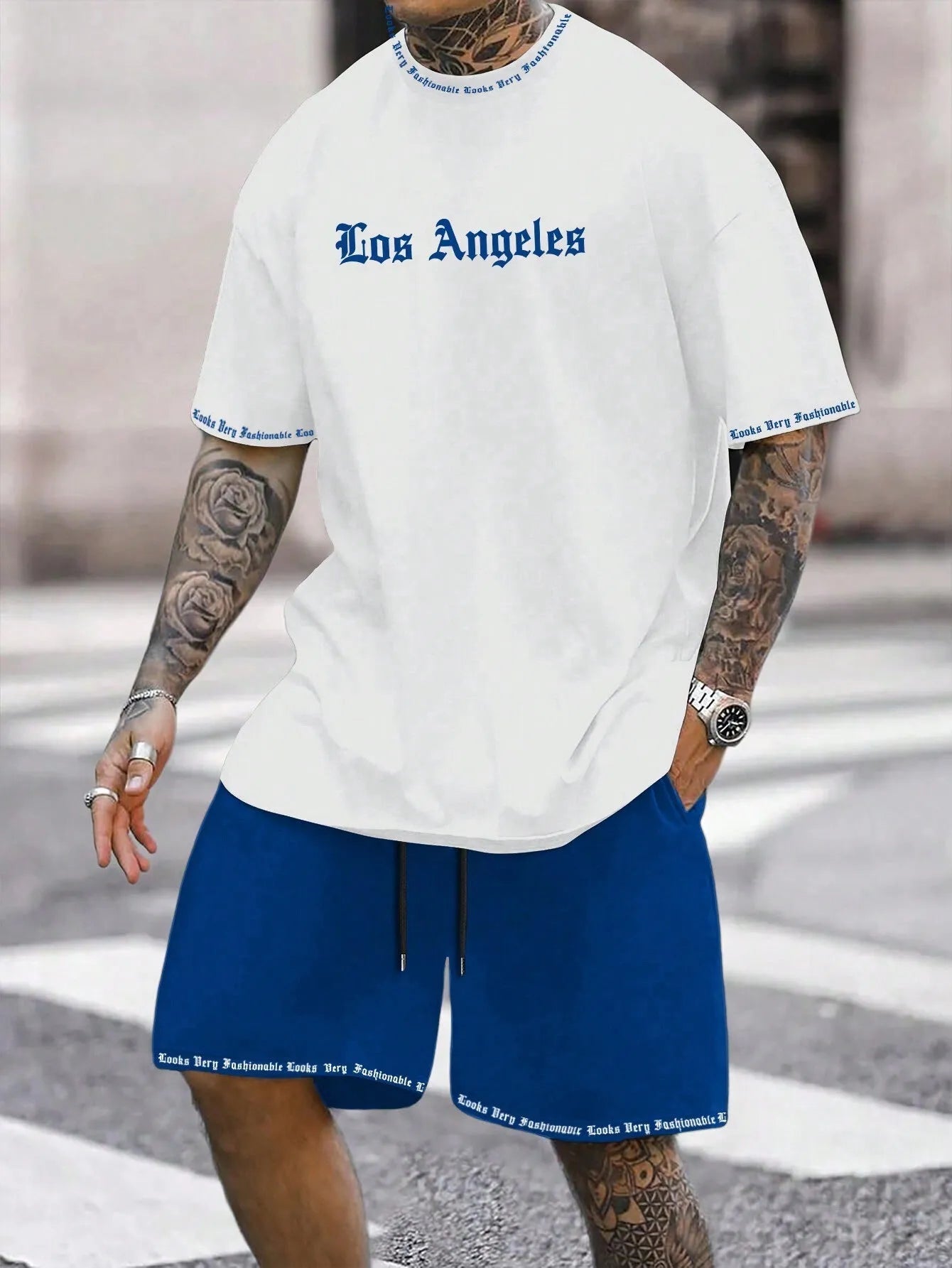 Sports-style short sleeve shirt and matching shorts set in a printed pattern, shown in colour G23P1573.