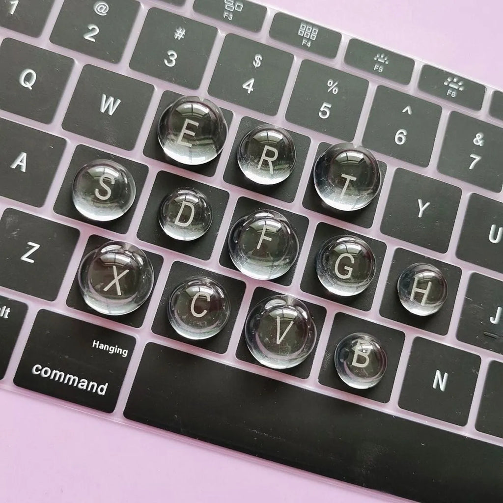 Crystal glass ball keyboard stickers in 12x6mm size on a white keyboard showing raised design