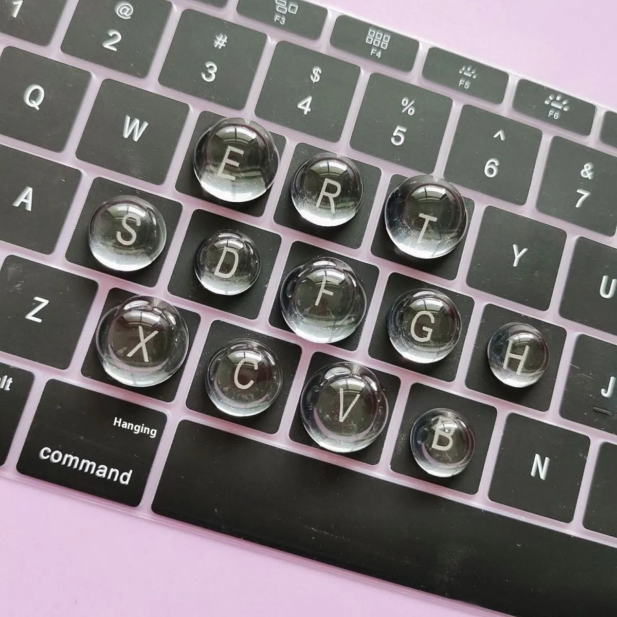 Crystal glass ball keyboard stickers in 12x6mm size on a white keyboard showing raised design