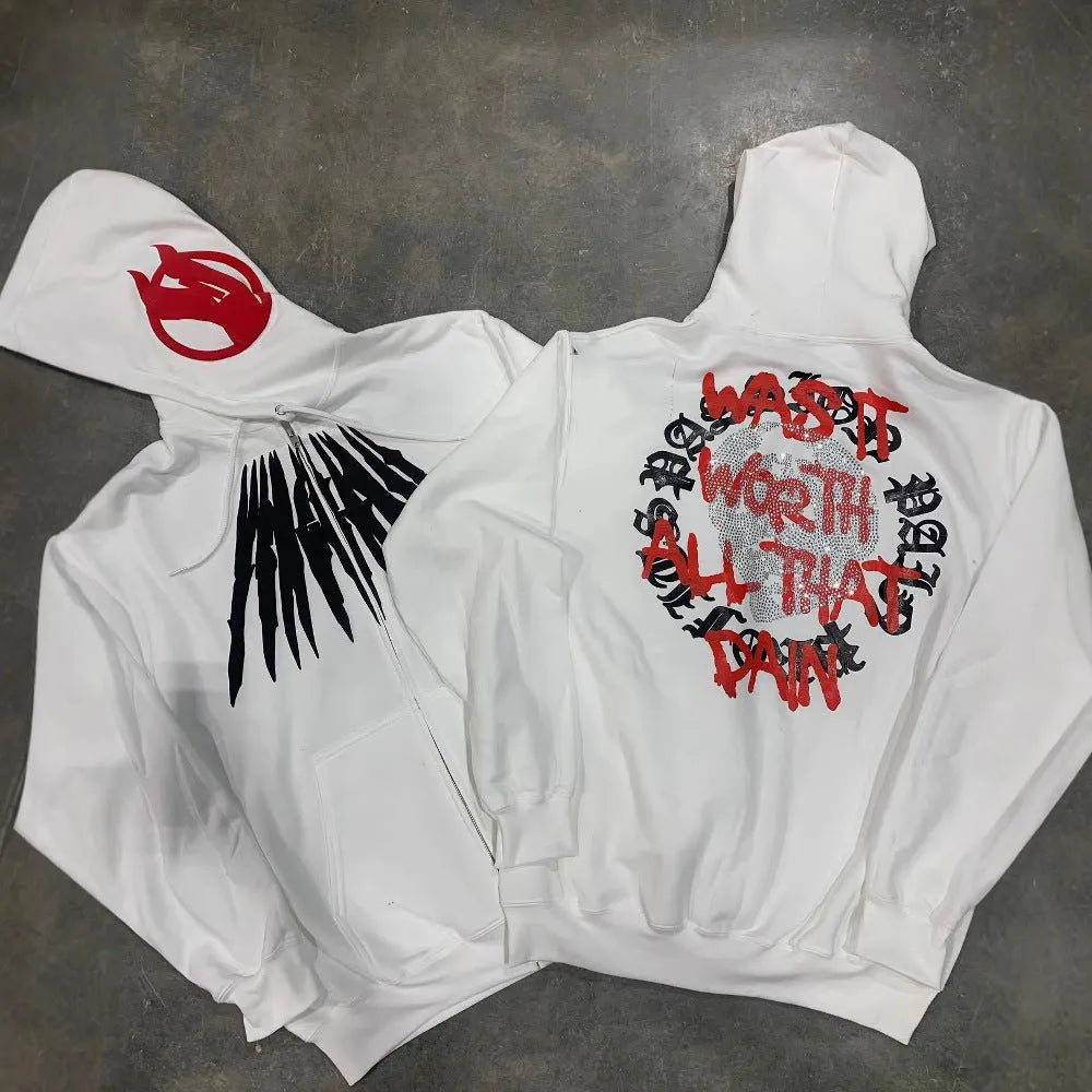 Black loose hooded sweatshirt with white printed skull design and rhinestone details on the front.