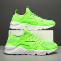 Men's green mesh low-top casual shoes with front laces and cross shoulder straps on a flat MD sole.