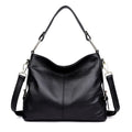 Genuine leather crossbody bag in a vertical square shape with visible sewing lines and a crossbody strap.