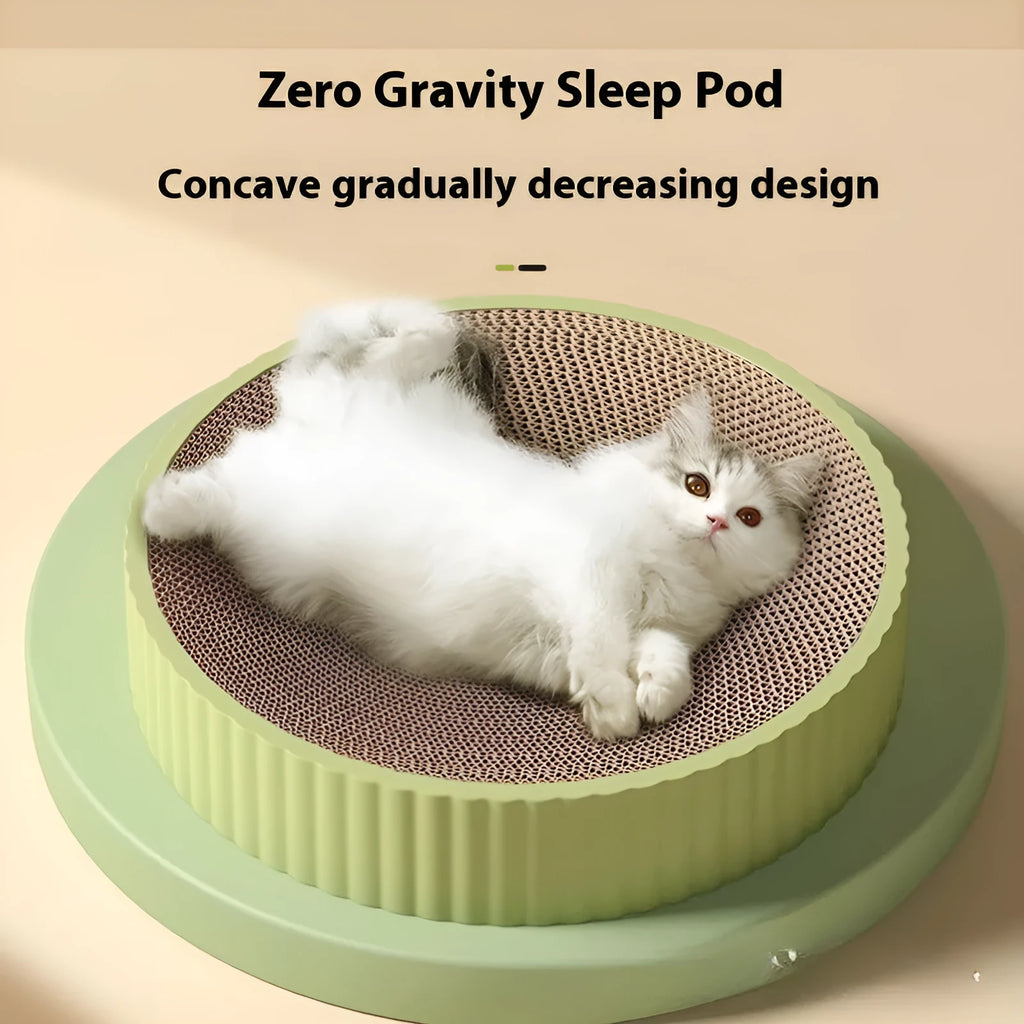 Round green cat scratching board with replaceable corrugated centre measuring 55 cm diameter