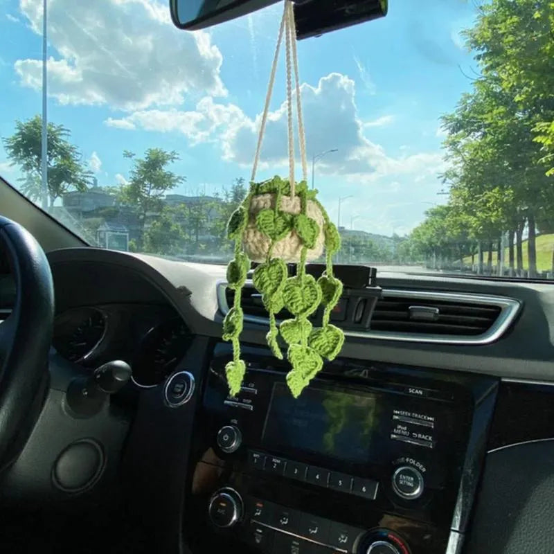 Green and white fish-scale style knitted wool car hanging planter with 8cm base and long white cord.