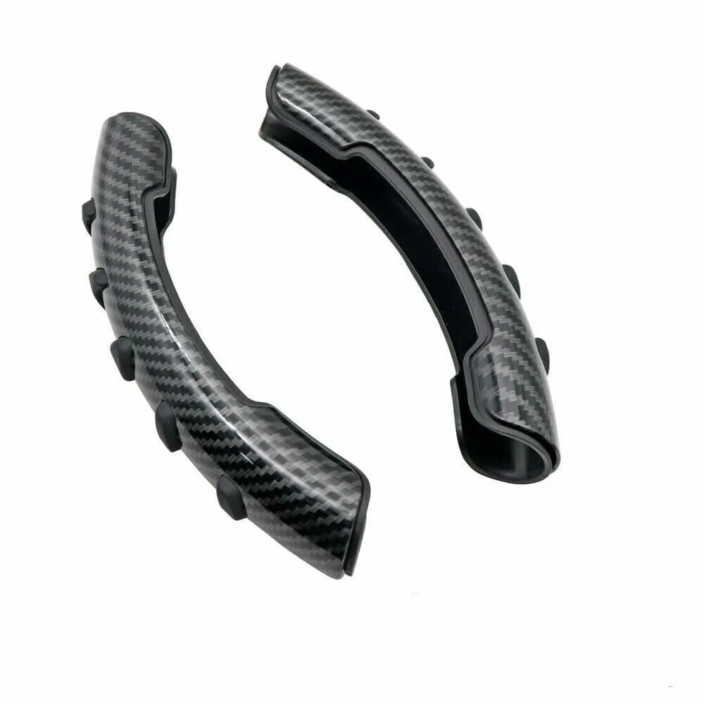Carbon fibre black fibre anti-skid sleeve on a car steering wheel.