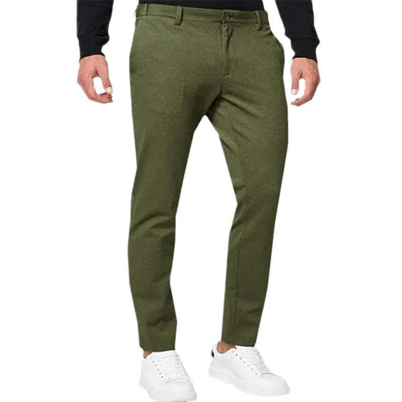 Men's slim-fit tapered chino trousers in Army Green colour, showing zipper fly and casual styling.