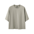 Men's sand grey loose-fit short sleeve t-shirt made from cotton and polyester blend fabric.
