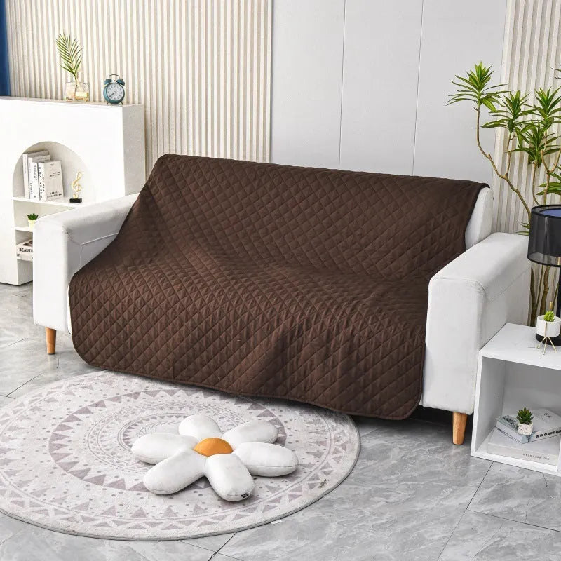 Reversible waterproof dog blanket couch cover in burgundy and grey, laid flat on a sofa.