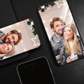 Patterned iPhone case with raised edges on a table next to an iPhone.