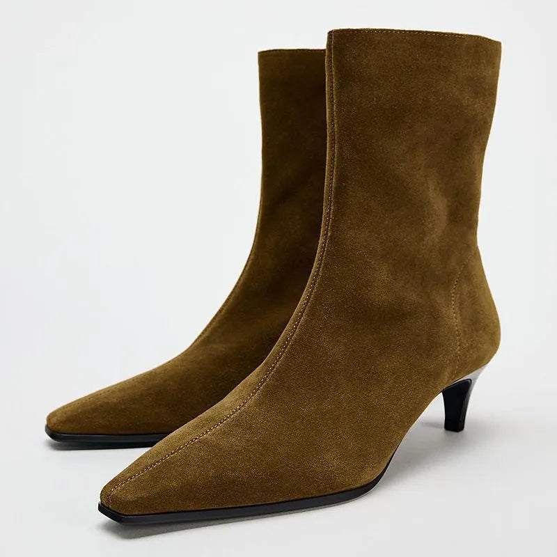 Brown women's square toe ankle boots with a side zipper and stiletto heel on a waterproof platform sole.