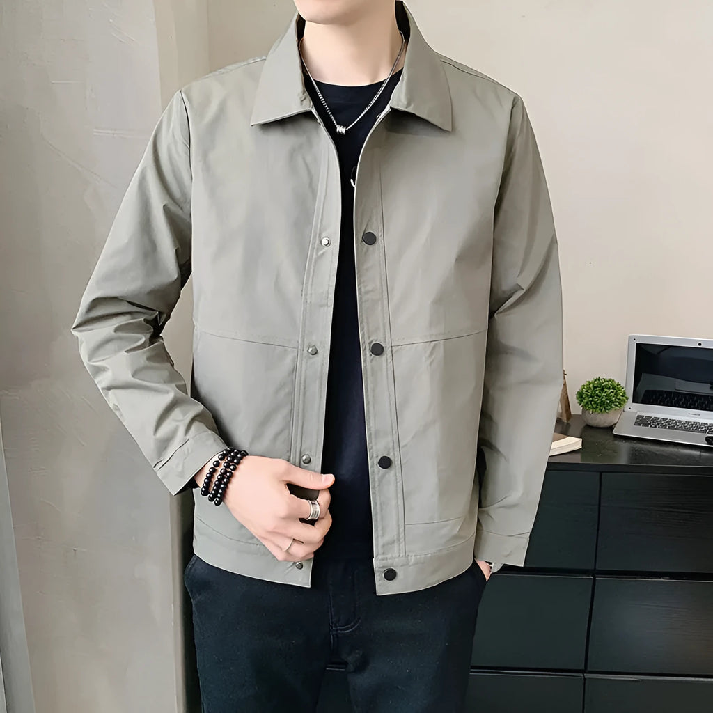 Man wearing a thin, single-layer Korean style jacket in light grey.