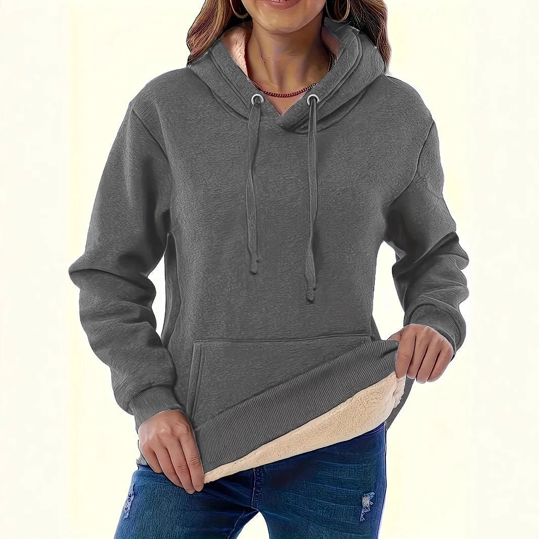 Women's loose black hooded sweater with pockets and a textured 3D pattern